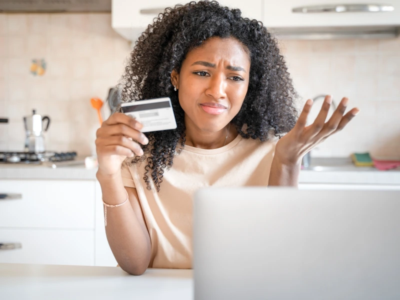 Image showing a frustration person in South Florida battling credit card debt.